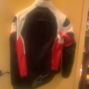 Men’s Alpinestars motorcycle jacket size large, red, black, and white
